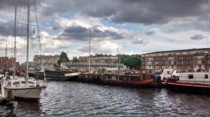 Image of Greenland Dock showing boats and blocks of flats behind